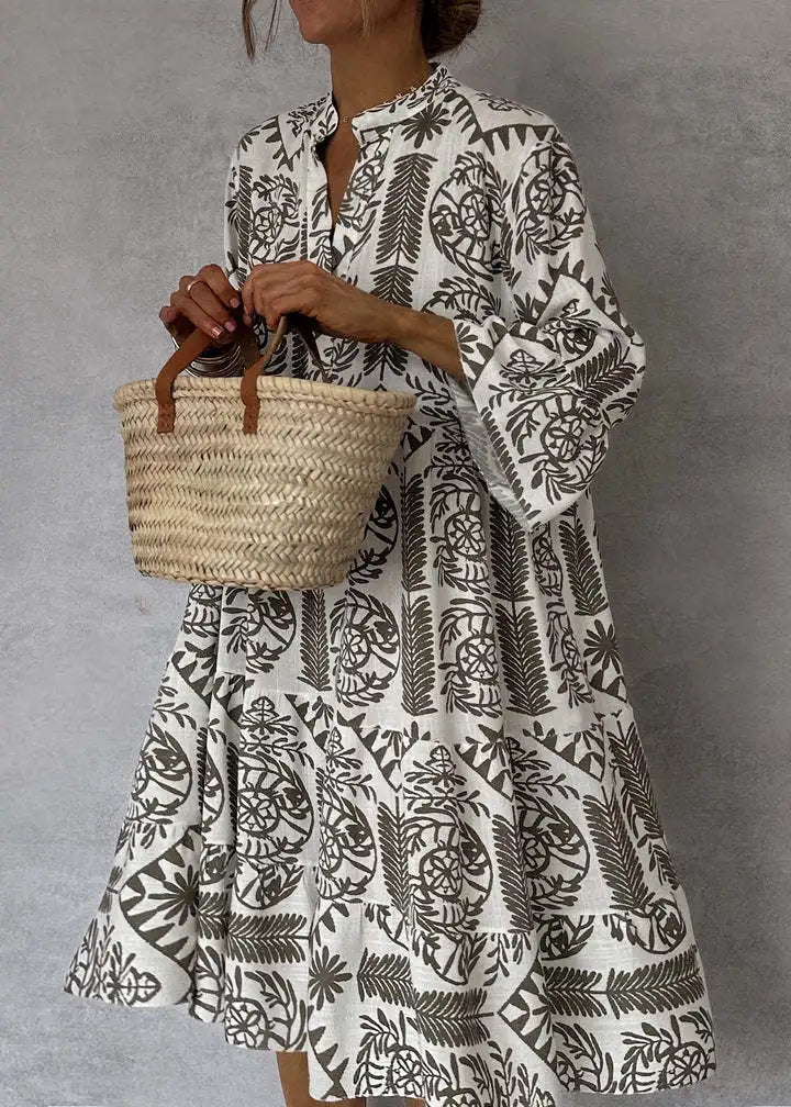 Vestido midi estampado con escote en V y manga tres cuartos