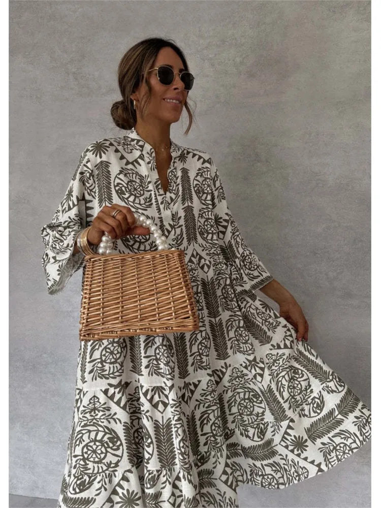 Vestido midi estampado con escote en V y manga tres cuartos