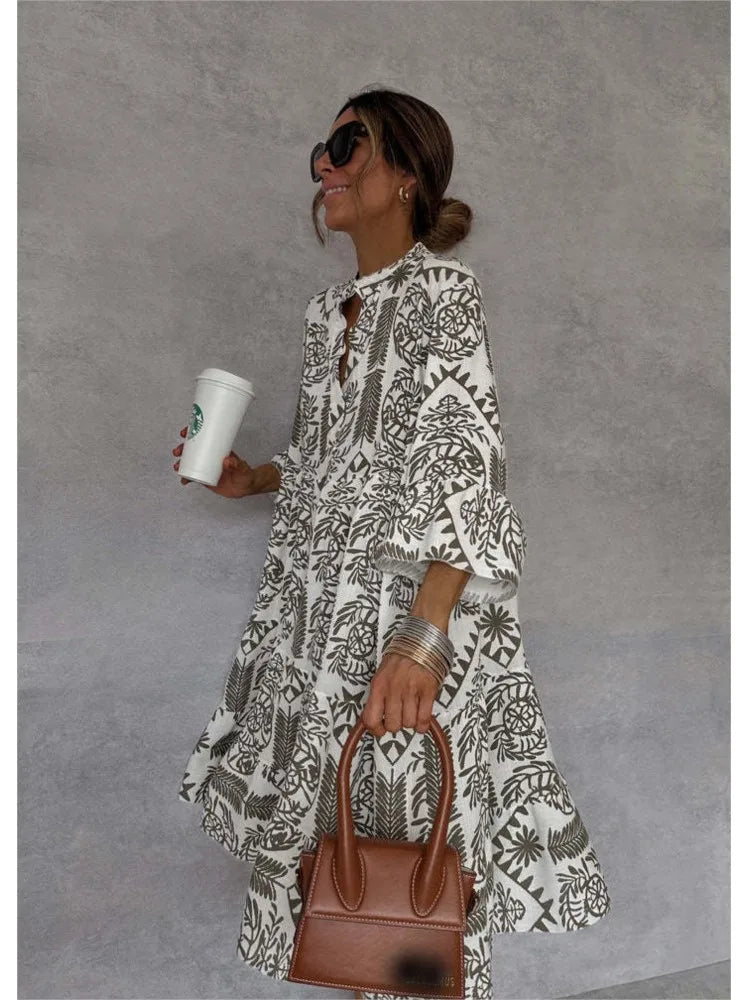 Vestido midi estampado con escote en V y manga tres cuartos
