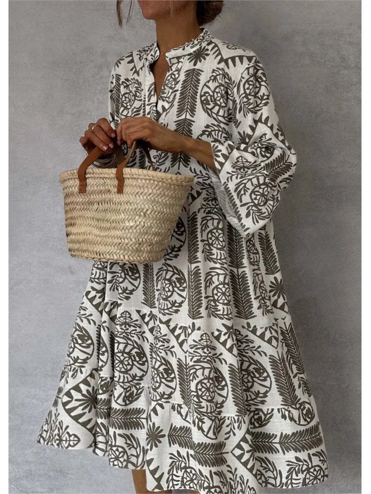 Vestido midi estampado con escote en V y manga tres cuartos