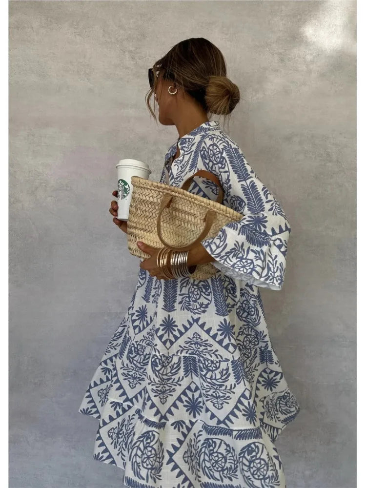 Vestido midi estampado con escote en V y manga tres cuartos